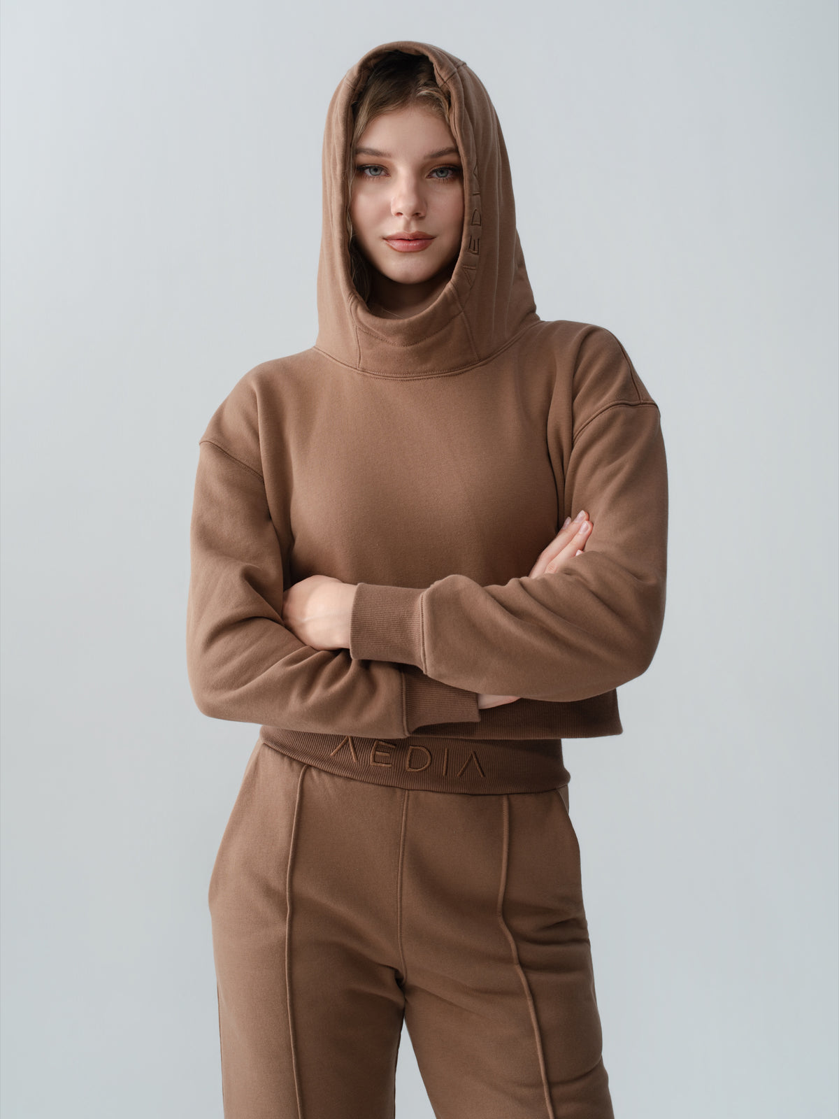Model wearing the AEDIA Funnel Hoodie in Double Shot