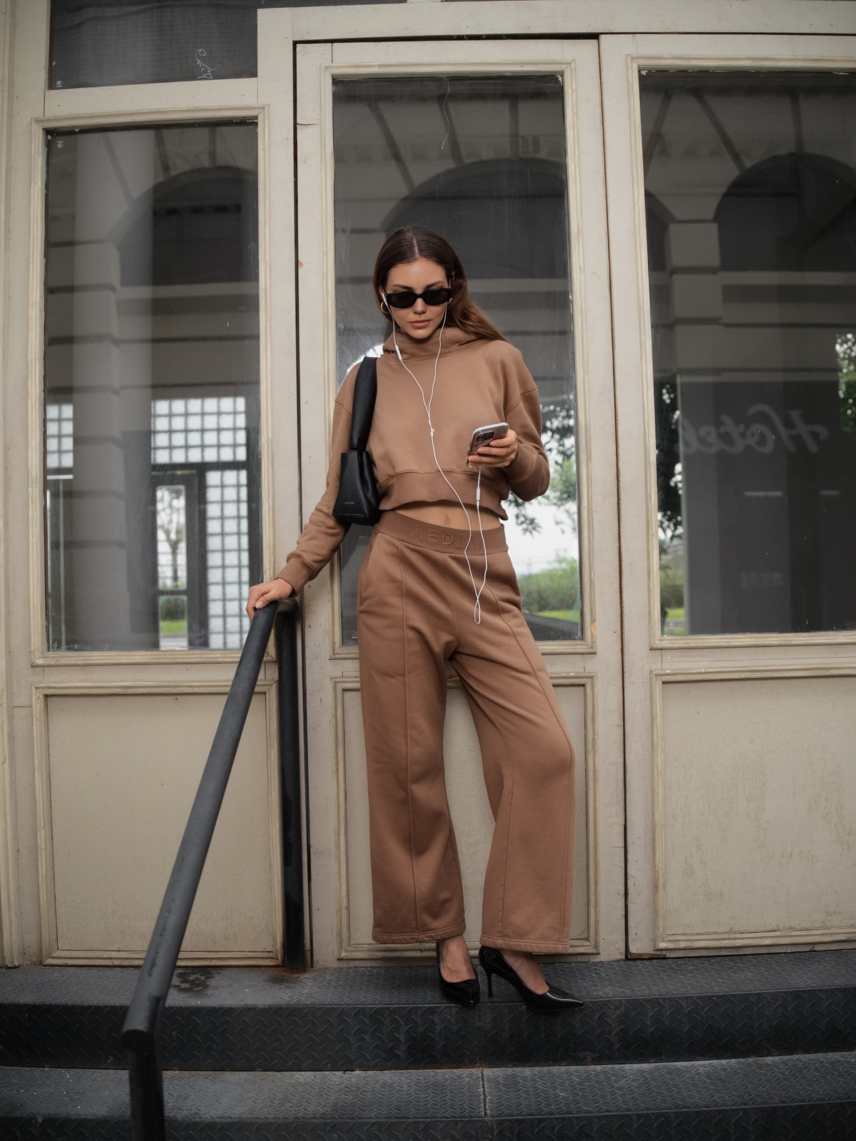 Editorial view of the AEDIA Wide Leg Pants in Double Shot