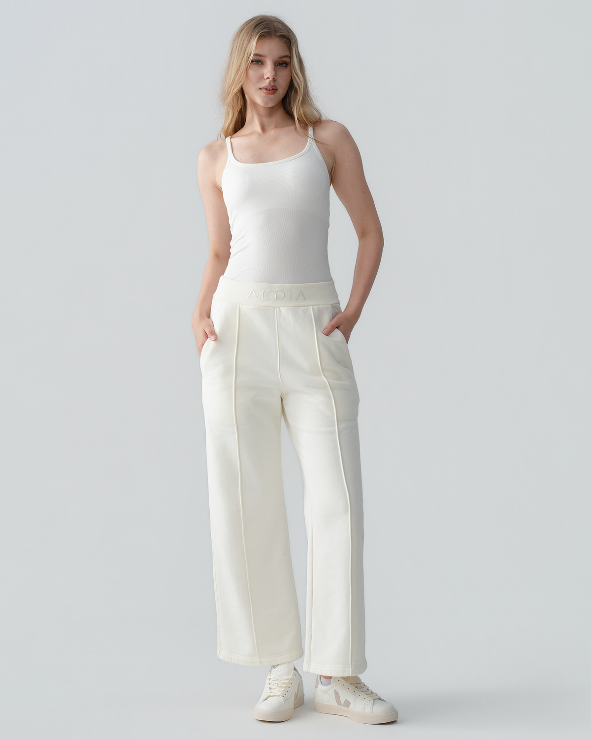 Model wearing the AEDIA Wide Leg Pants in Milk